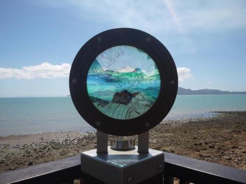 A damaged public art installation in Townsville looking onto Magnetic Island. A damaged public art installation in Townsville looking onto Magnetic Island.